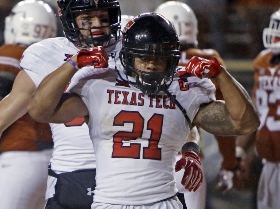 Texas Tech's DeAndre Washington (21) celebrates his touchdown during the second half of an NCAA college football game against Texas, Thursday, Nov. 26, 2015, in Austin, Texas. Texas Tech won 48-45. (AP Photo/Michael Thomas)