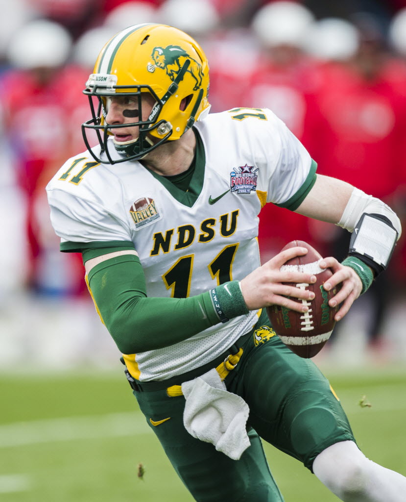 North Dakota State quarterback Carson Wentz holds his jersey after