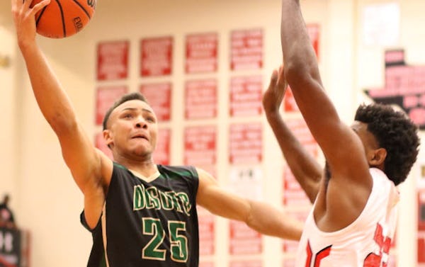 DeSoto guard Brandon Butler (25) drives to the basket as Cedar Hill forward Terrence Jones (23) defends during first half action. The two teams played their District 8-6A basketball game at Cedar Hill High School on January 15, 2016. (Steve Hamm/Special Contributor)