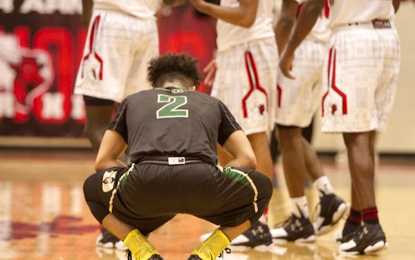 DeSoto guard Julian Miranda (2) pauses after taking a hard hit to the floor during first half action against Cedar Hill. The two teams played their District 8-6A basketball game at Cedar Hill High School on January 15, 2016. (Steve Hamm/Special Contributor)