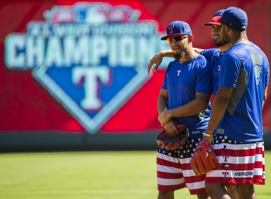 Texas Rangers second baseman Rougned Odor (12), left, Texas Rangers catcher Robinson Chirinos (61) and Texas Rangers shortstop Elvis Andrus (1) during practice on Tuesday, October 6, 2015 at Globe Life Park in Arlington, Texas.   (Ashley Landis/The Dallas Morning News)