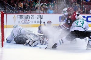 Feb 18, 2016; Glendale, AZ, USA; Arizona Coyotes center Max Domi (16) picks up a rebound from Dallas Stars goalie Antti Niemi (31) and scores a goal as defenseman Alex Goligoski (33) defends and left wing Anthony Duclair (10) falls to the ice during the second period at Gila River Arena. Mandatory Credit: Matt Kartozian-USA TODAY Sports