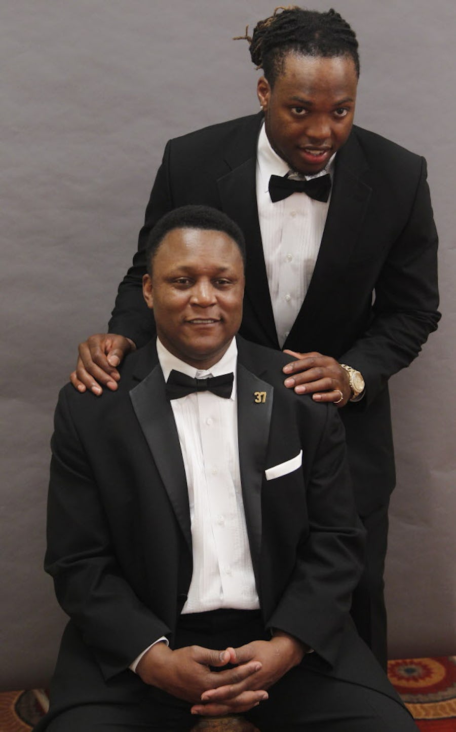 Derrick Henry, top, and Barry Sanders, bottom pose for photos at the  PwC Doak Walker Legends Award at the Hilton Anatole Hotel in Dallas, on February 19, 2016. (Michael Ainsworth/Special Contributor)