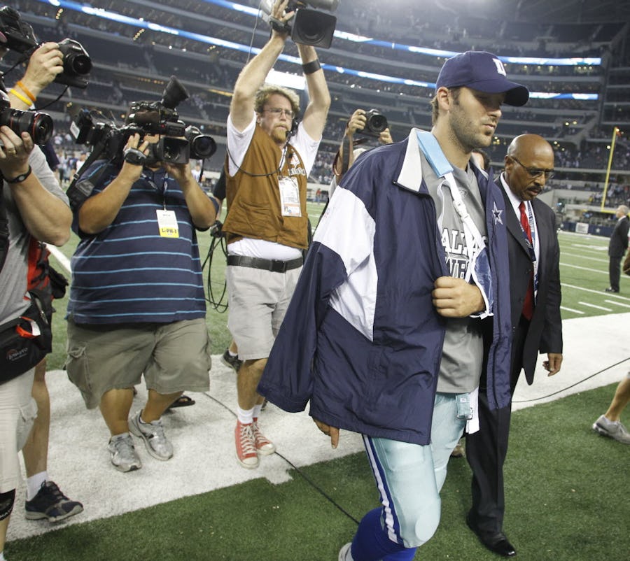 Tony Romo walks off the field with his arm in a sling after breaking his collarbone when the New York Giants played the Dallas Cowboys at Cowboys Stadium in Arlington, TX, Monday, October 25, 2010. (Star-Telegram/Sharon Ellman)