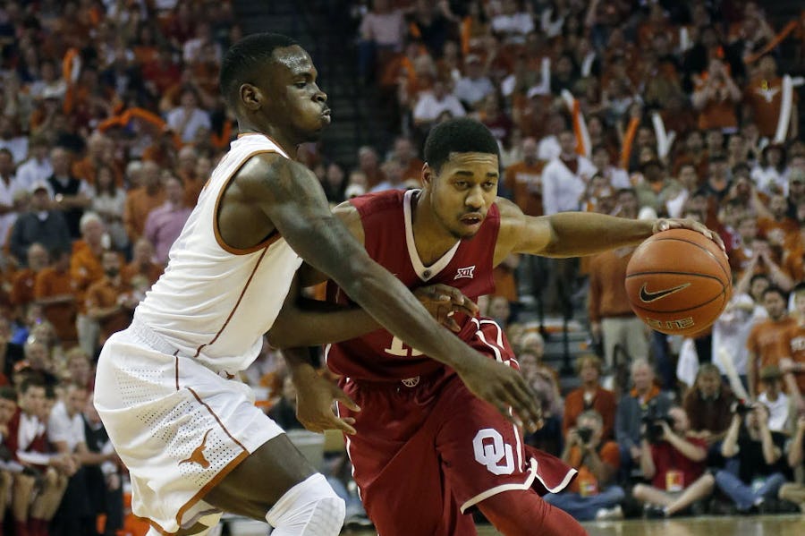 AUSTIN, TX - FEBRUARY 27: Isaiah Cousins #11 of the Oklahoma Sooners drives around Kendal Yancy #5 of the Texas Longhorns at the Frank Erwin Center on February 27, 2016 in Austin, Texas.