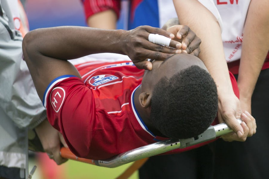 Mar 6, 2016; Dallas, TX, USA; FC Dallas forward Fabian Castillo (11) is taken off the field after being hurt in the match against the Philadelphia Union at Toyota Stadium. FC Dallas won 2-0. Mandatory Credit: Tim Heitman-USA TODAY Sports