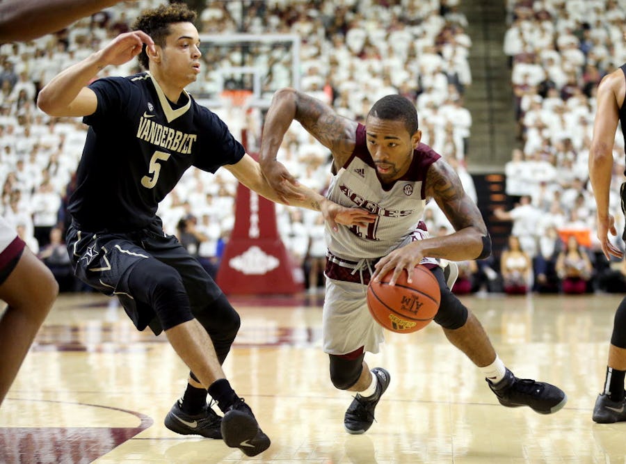 Texas A&M's Anthony Collins (11) drives the lane against Vanderbilt's Matthew Fisher-Davis (5) during the first half of an NCAA college basketball game, Saturday, March 5, 2016, in College Station, Texas. (AP Photo/Sam Craft)