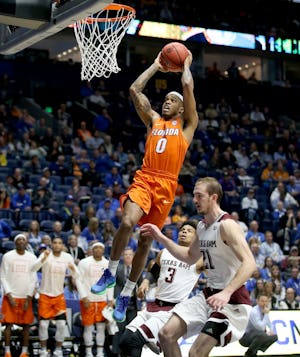 NASHVILLE, TN - MARCH 11:  Kasey Hill #0 of the Florida Gators shoots the ball in the game against the Texa A&M Aggies during the quarterfinals of the SEC Basketball Tournament at Bridgestone Arena on March 11, 2016 in Nashville, Tennessee.  (Photo by Andy Lyons/Getty Images)