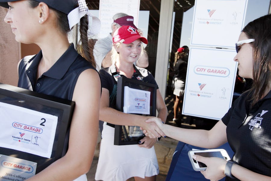Maddie Szeryk, of Texas A&M, is congratulated by Kristy Nutt, tournament director, after Maddie finished first in the amateur qualifying rounds for the Volunteers of America high school and college shootout golf tournament, on Wednesday, March 16, 2016 at Las Colinas Country Club in Irving. The woman golfer at left is Cheyenne Knight of the University of Alabama who finished second behind Luitwieler. Ben Torres/Special Contributor
