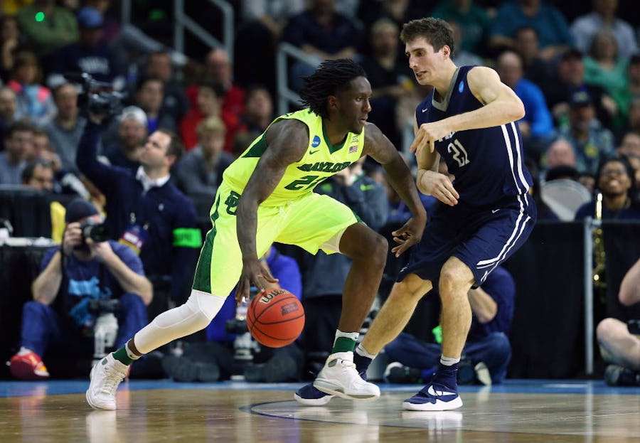 PROVIDENCE, RI - MARCH 17:  Taurean Prince #21 of the Baylor Bears drives against Nick Victor #21 of the Yale Bulldogs in the first half of their game during the first round of the 2016 NCAA Men's Basketball Tournament at Dunkin' Donuts Center on March 17, 2016 in Providence, Rhode Island.  (Photo by Jim Rogash/Getty Images)