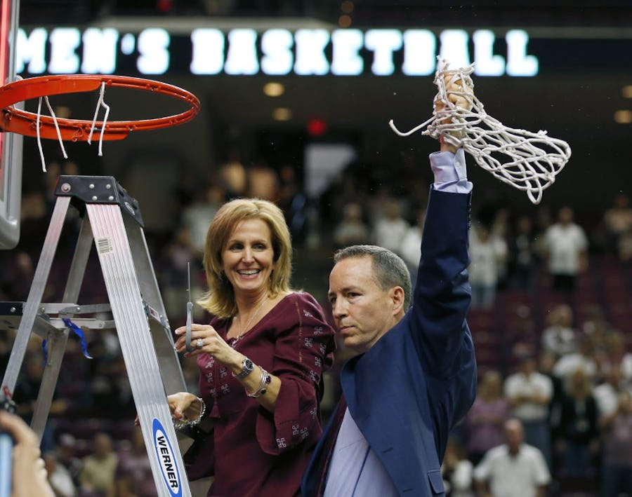 Mar 5, 2016; College Station, TX, USA; Texas A&M Aggies head coach Billy Kennedy and his wife Mary cut the final bits of net after beating the Vanderbilt Commodores 76-67 and win the SEC Championship at Reed Arena. Mandatory Credit: Erich Schlegel-USA TODAY Sports