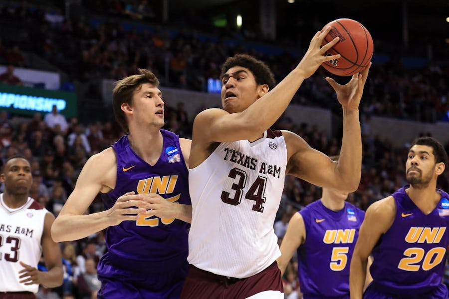 OKLAHOMA CITY, OK - MARCH 20:  Tyler Davis #34 of the Texas A&M Aggies drives to the basket against Bennett Koch #25 of the Northern Iowa Panthers in the first half during the second round of the 2016 NCAA Men's Basketball Tournament at Chesapeake Energy Arena on March 20, 2016 in Oklahoma City, Oklahoma.  (Photo by Tom Pennington/Getty Images)