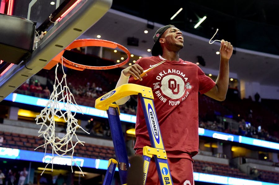 ANAHEIM, CA - MARCH 26:  Buddy Hield #24 of the Oklahoma Sooners smiles after cutting a piece of the net after the Sooners 80-68 victory against the Oregon Ducks in the NCAA Men's Basketball Tournament West Regional Final at Honda Center on March 26, 2016 in Anaheim, California.  (Photo by Harry How/Getty Images) ***BESTPIX***