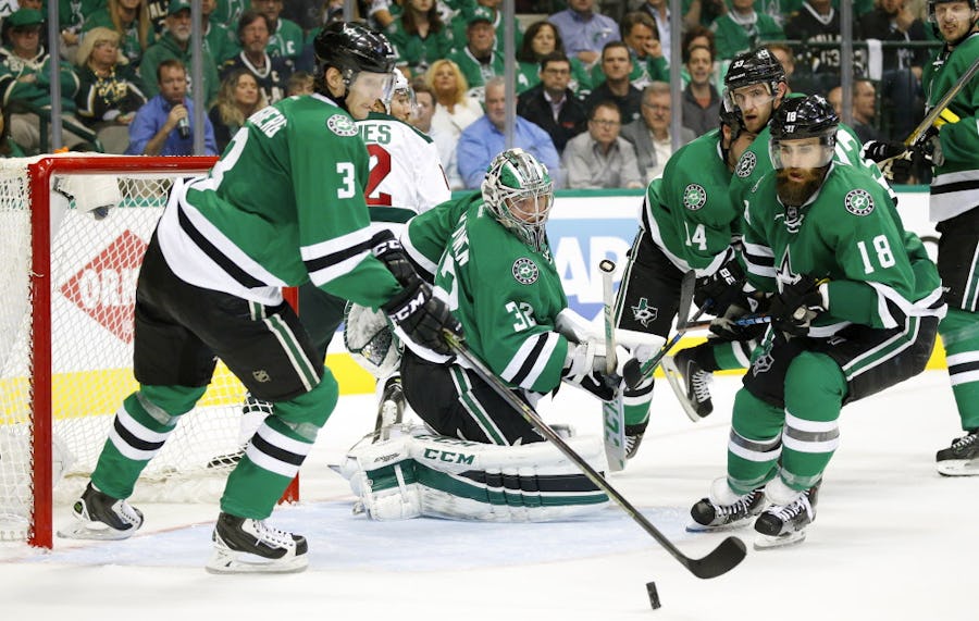 Dallas Stars goalie Kari Lehtonen (32) looks to his defenseman John Klingberg (3) and right wing Patrick Eaves (18) to clear a shot on goal by the Minnesota Wild  in the second period of playoff Game 1at the American Airlines Center in Dallas,Thursday, April 14, 2016. (Tom Fox/The Dallas Morning News)