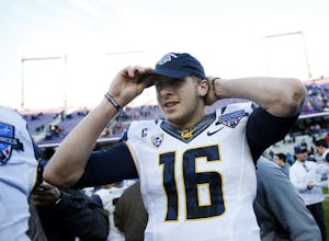 California Golden Bears quarterback Jared Goff (16) puts on a Lockheed Martin Armed Forces Bowl championship hat after winning against the Air Force Falcons at Amon G. Carter Stadium in Fort Worth, Texas on Dec. 29, 2015. (Rose Baca/The Dallas Morning News)