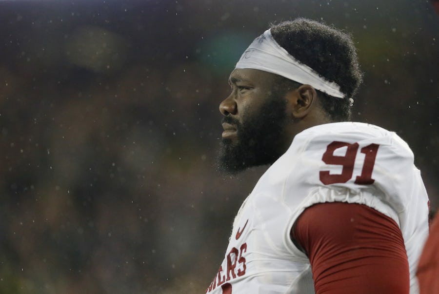 Oklahoma defensive end Charles Tapper (91) watches play against Baylor from the sideline during an NCAA college football game Saturday, Nov. 14, 2015, in Waco, Texas. (AP Photo/Tony Gutierrez)