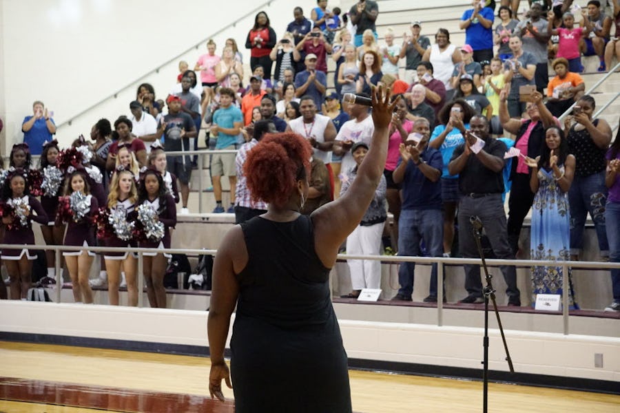 Michelle Carter greets the audience during a send off for Michelle at Red Oak High School in Red Oak, Texas on Tuesday, July 19, 2019. Carter, a Red Oak graduate and national shot put record holder will be competing in her third Oympics. (Lawrence Jenkins/Special Contributor)