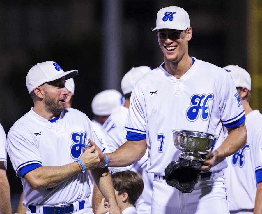 Dallas Mavericks forward Dwight Powell (7) celebrates being named the MVP with White Sox teammate Dallas Mavericks guard J.J. Barea (5) during Dirk Nowitzki's 2016 Heroes Celebrity Baseball Game on Friday, June 10, 2016 at Dr Pepper Ballpark in Frisco, Texas. The White Sox won 16-12 over the Blue Sox. (Ashley Landis/The Dallas Morning News)