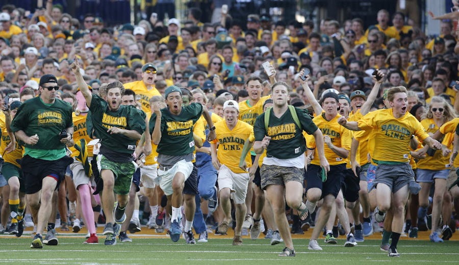 Baylor students storm the field in their pre-game tradition before the Northwestern State University Demons vs. the Baylor University Bears NCAA football game at McLane Stadium in Waco, Texas on Friday, September 2, 2016. (Louis DeLuca/The Dallas Morning News)