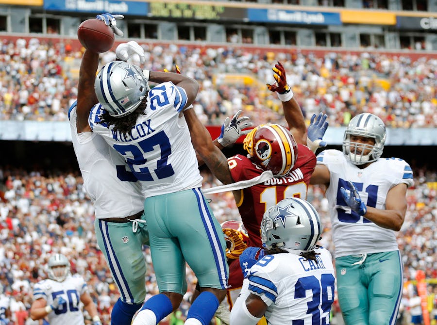 Dallas Cowboys free safety Byron Jones (31) and Dallas Cowboys free safety J.J. Wilcox (27) knock away a ball intended for Washington Redskins wide receiver Josh Doctson (18) on a hail mary attempt during the second half of play at FedEx Field in Landover, Maryland on Sunday, September 18, 2016. The Dallas Cowboys defeated the Washington Redskins 27-23. (Vernon Bryant/The Dallas Morning News)