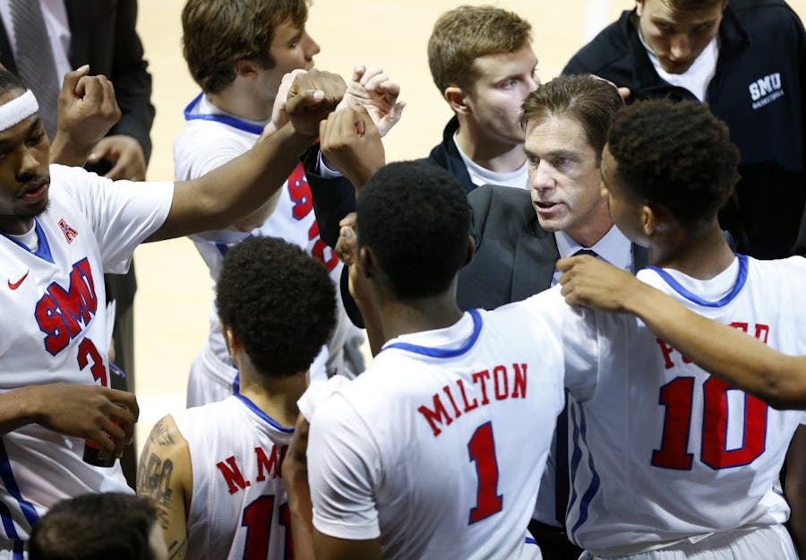 Southern Methodist Mustangs associate head coach Tim Jankovich (right) huddle his players during a timeout against the Nicholls State Colonels in the first half at Moody Coliseum on the SMU campus in University Park, Texas, Wednesday, December 16, 2015.  (Tom Fox/The Dallas Morning News)