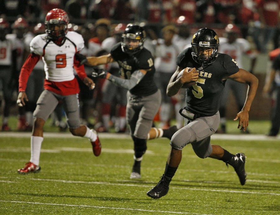 Mansfield's Kennedy Brooks runs the ball in for a touchdown against Cedar Hill during their game at Vernon Newsom Stadium  in Mansfield, Texas October 29, 2015. (Nathan Hunsinger The Dallas Morning News)