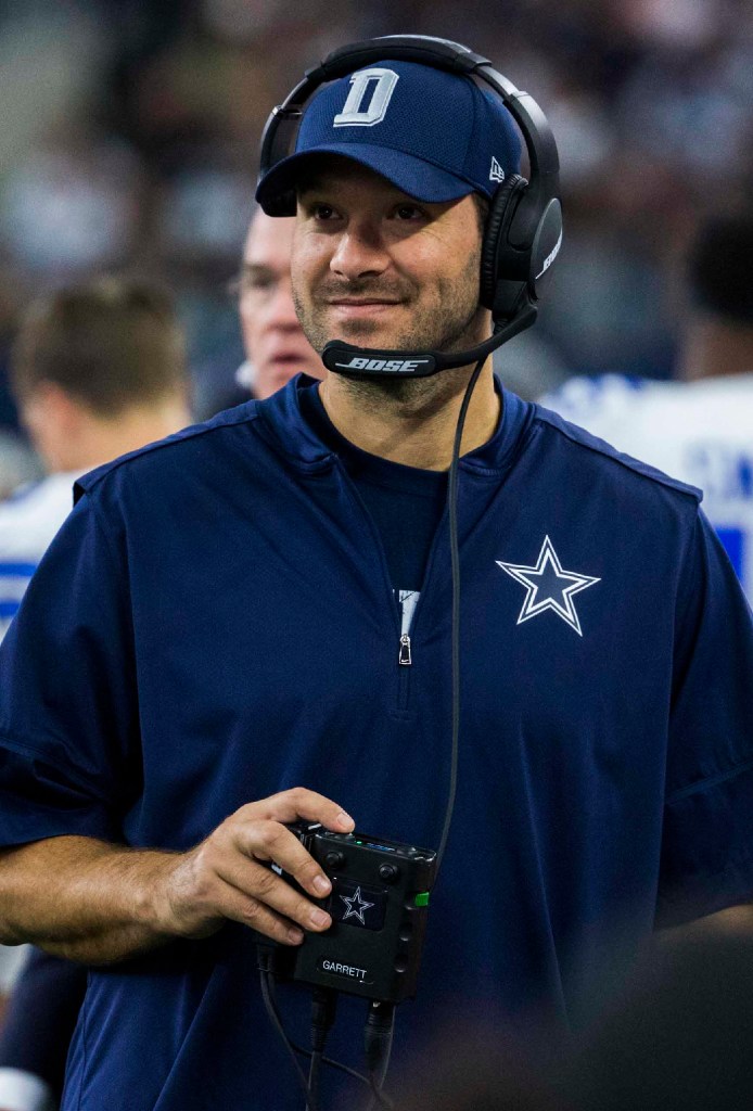 Dallas Cowboys offensive coordinator Jason Garrett (R) talks to quarterback  Tony Romo late in the fourth quarter against the Denver Broncos at Invesco  Field at Mile High in Denver on October 4