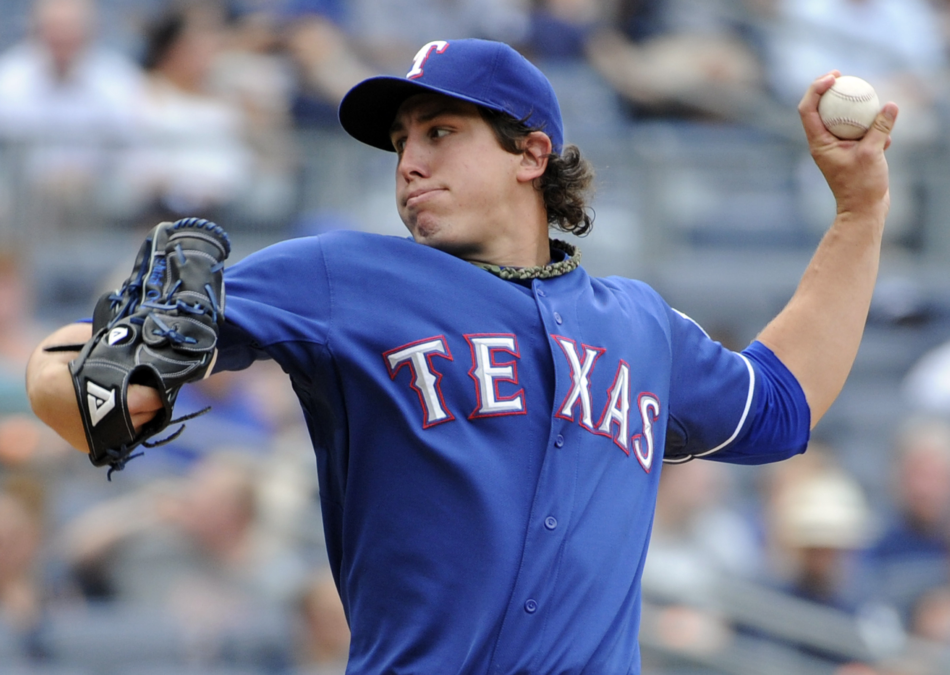 Texas Rangers starting pitcher Derek Holland works against the