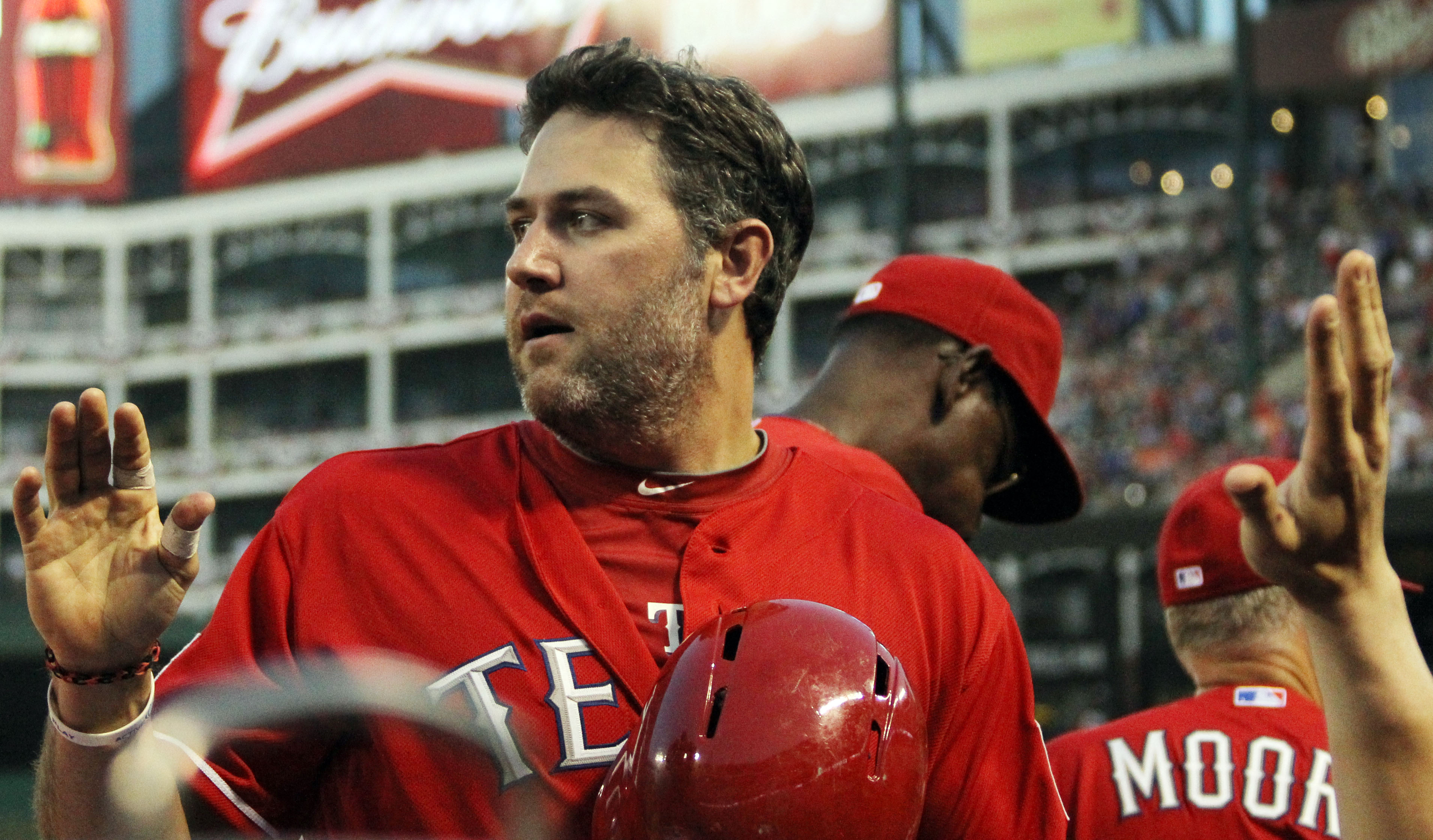 Houston Astros' Lance Berkman walks back to the dugout after