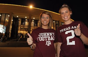 Aggie students Savannah Hughes, left, and Emily Kaiser come dressed for success as they wait to get in to the Heisman watch party for Texas A&M quarterback Johnny Manziel, held at the Association of Former Students building on the campus of Texas A&M University in College Station on Saturday, December 8, 2012. (Louis DeLuca/The Dallas Morning News)