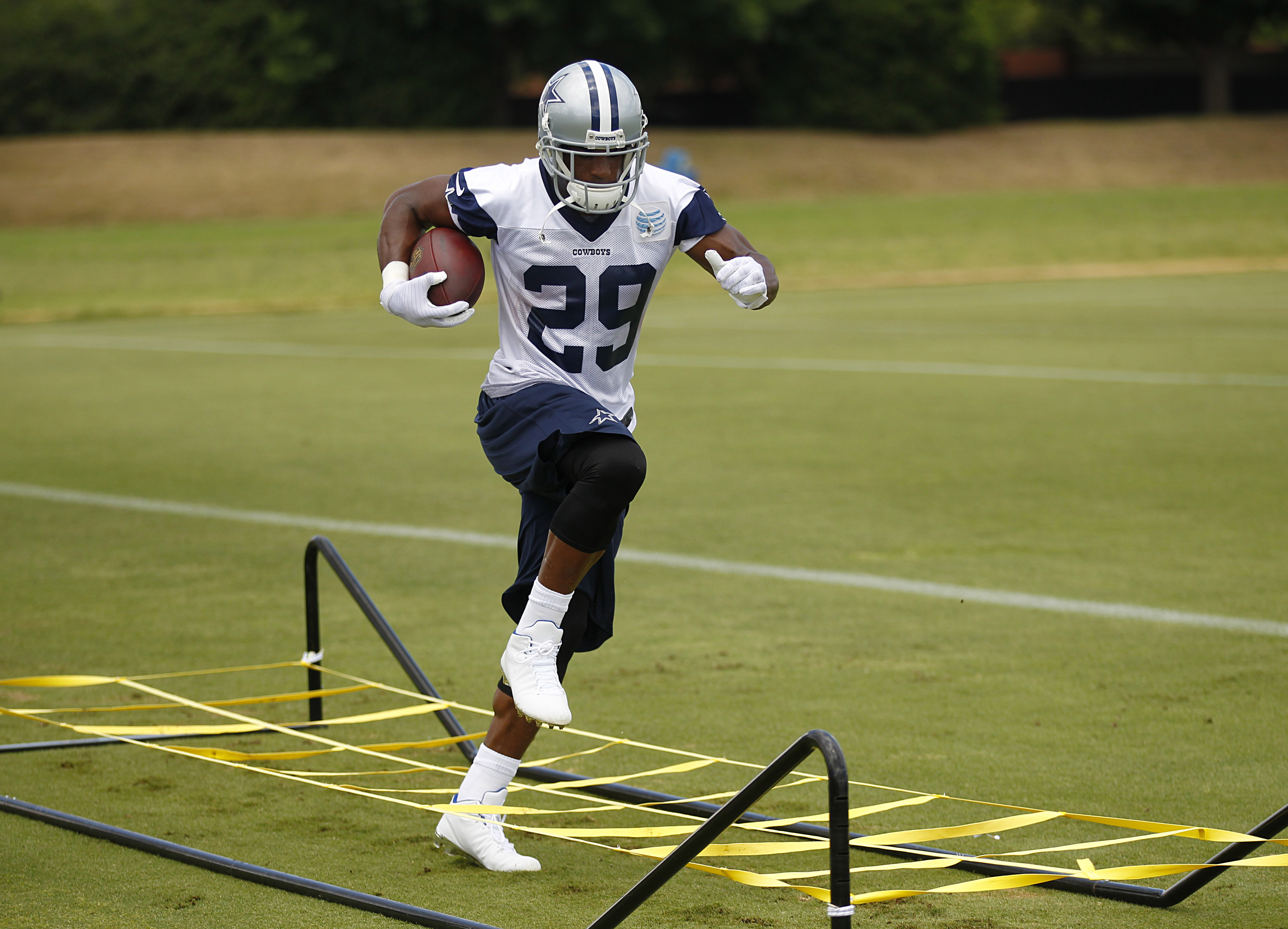 DeMARCO MURRAY hurdles over BRANDON CARR