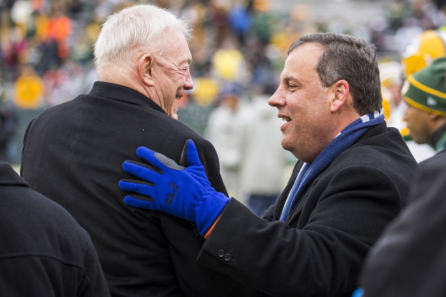 New Jersey Governor Chris Christie talks with Dallas Cowboys owner Jerry Jones on the sidelines before an NFC divisional round playoff game against the Green Bay Packers at Lambeau Field on Sunday, Jan. 11, 2015, in Green Bay.