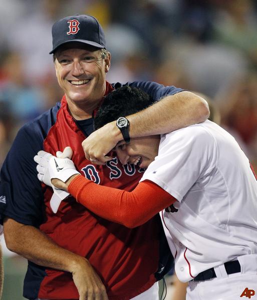 Texas Rangers hitting coach Rudy Jaramillo tips his hat to the