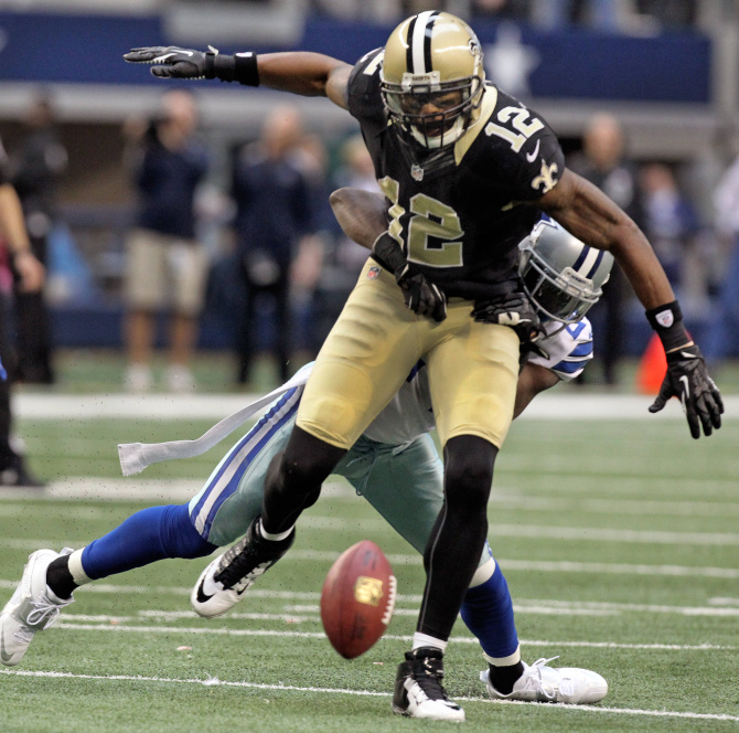 Dallas Cowboys free safety Gerald Sensabaugh (43) tries to bring down New  Orleans Saints wide receiver Marques Colston (12) during the first half of  an NFL football game Sunday, Dec. 23, 2012