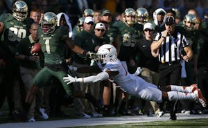 Baylor wide receiver Corey Coleman (1) is pushed out of bounds by Texas defensive back Jermaine Roberts Jr. (16) during the second half at McLane Stadium on Saturday, Dec. 5, 2015, in Waco, Texas. Texas won 23-17.