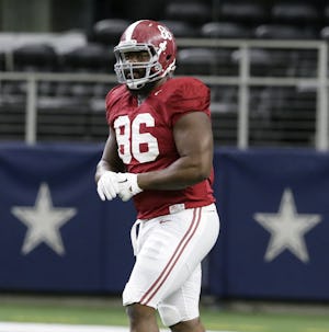 Alabama defensive lineman A'Shawn Robinson (86) runs a drill during team practice for the NCAA Cotton Bowl college football game against against the Michigan State Monday, Dec. 28, 2015, in Arlington, Texas. (AP Photo/LM Otero)