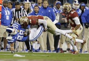 In this Saturday, Dec. 7, 2013, file photo, Duke's Braxton Deaver (89) is hit by Florida State's Jalen Ramsey (13) in the first half of the Atlantic Coast Conference Championship NCAA football game in Charlotte, N.C.