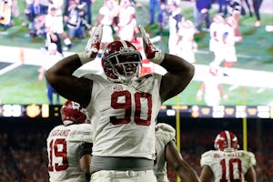 Jarran Reed #90 of the Alabama Crimson Tide celebrates a play against the Clemson Tigers during the 2016 College Football Playoff National Championship Game at University of Phoenix Stadium on January 11, 2016 in Glendale, Arizona. (Photo by Christian Petersen/Getty Images)
