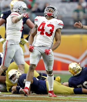 Ohio State linebacker Darron Lee (43) celebrates his sack against Notre Dame during the second half of the Fiesta Bowl NCAA College football game, Friday, Jan. 1, 2016, in Glendale, Ariz. Ohio State won 44-28. (AP Photo/Ross D. Franklin)