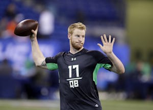 North Dakota State quarterback Carson Wentz runs a drill at the NFL football scouting combine on Saturday, Feb. 27, 2016, in Indianapolis. (AP Photo/Darron Cummings)