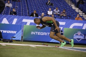 Clemson defensive lineman Kevin Dodd runs the 40-yard dash at the NFL football scouting combine in Indianapolis, Sunday, Feb. 28, 2016. (AP Photo/Michael Conroy)