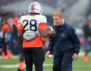 North squad head coach Jason Garrett of the Dallas Cowboys works with running back Kenneth Dixon of Louisiana Tech (28) during Senior Bowl practice at Ladd-Peebles Stadium. Mandatory Credit: Glenn Andrews-USA TODAY Sports