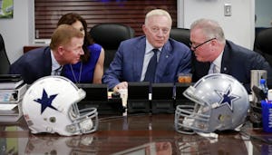 (from left) Dallas Cowboys head coach Jason Garrett, Executive Vice President and Chief Brand Officer Charlotte Jones Anderson, Owner Jerry Jones, and Executive Vice President, CEO, and Director of Player Personnel Stephen Jones visit in the War Room before making their first pick before the NFL Draft gets underway at Valley Ranch Thursday, April 28, 2016. (Tom Fox/The Dallas Morning News)