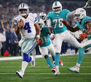 Dallas Cowboys quarterback Dak Prescott (4) scores a rushing touchdown to make the score 20-7 in the second quarter during a preseason National Football League game between the Miami Dolphins and the Dallas Cowboys at AT&T Stadium in Arlington, Texas Friday August 19, 2016. (Andy Jacobsohn/The Dallas Morning News)