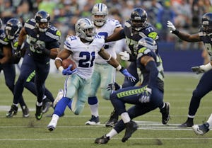 Dallas Cowboys running back Ezekiel Elliott (21) rushes against the Seattle Seahawks in the first half of a preseason NFL football game, Thursday, Aug. 25, 2016, in Seattle. The Seahawks beat the Cowboys 27-17. (AP Photo/Stephen Brashear)