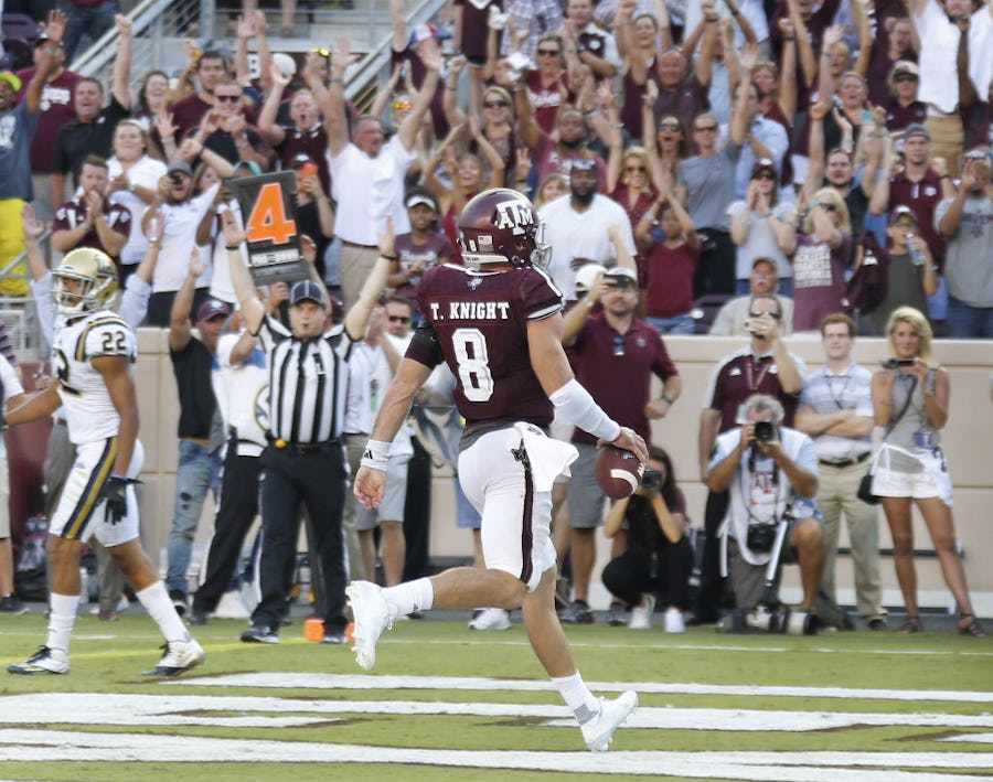 Texas A&M quarterback Trevor Knight (8) scores the winning touchdown in overtime giving the Aggies a 31-24 win during the UCLA Bruins vs. the Texas A&M Aggies NCAA football game at Kyle Field in College Station, Texas on Saturday, September 3, 2016. (Louis DeLuca/The Dallas Morning News)