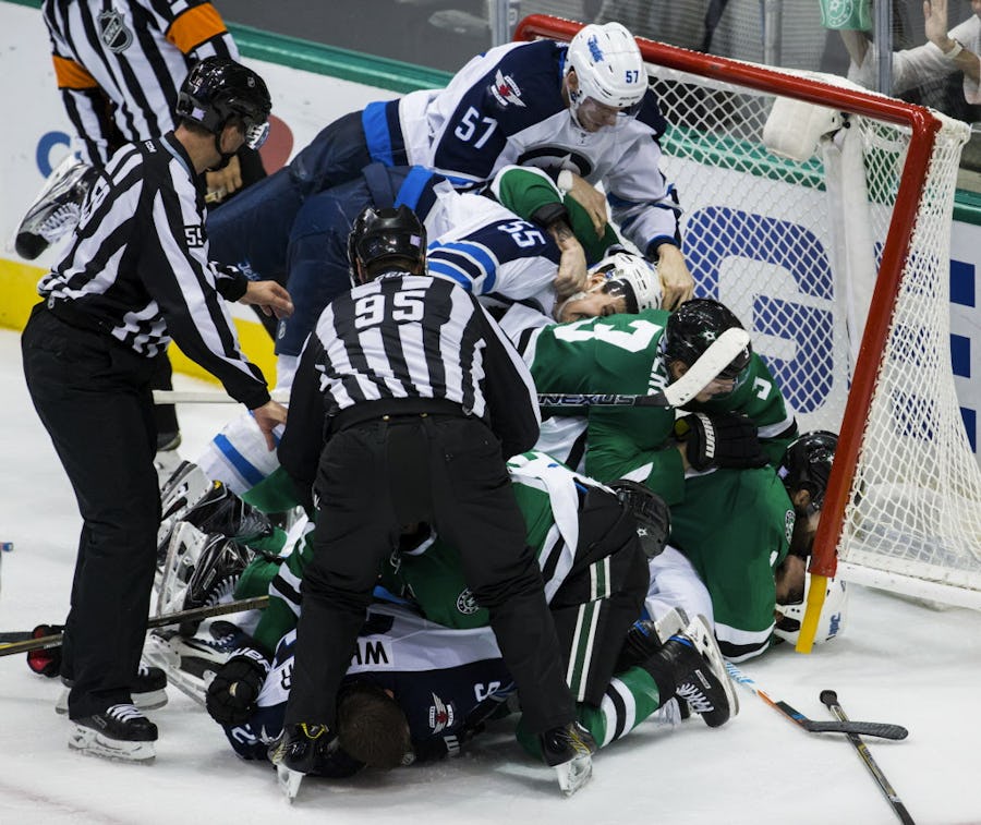 The Dallas Stars and Winnipeg Jets end up in the goal during a fight in the third period of their game on Tuesday, October 25, 2016 at the American Airlines Center in Dallas. (Ashley Landis/The Dallas Morning News)