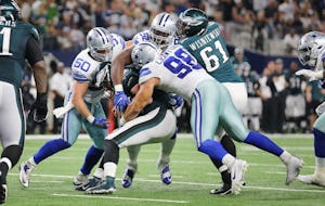 Dallas Cowboys defensive tackle Cedric Thornton (92) and defensive end Tyrone Crawford (98) sack Philadelphia Eagles quarterback Carson Wentz (11) in the fourth quarter with outside linebacker Sean Lee (50) nearby during a National Football League game between the Philadelphia Eagles and Dallas Cowboys at AT&T Stadium in Arlington, Texas Sunday October 30, 2016. The Dallas Cowboys beat the Philadelphia Eagles 29-23 in overtime. (Andy Jacobsohn/The Dallas Morning News)