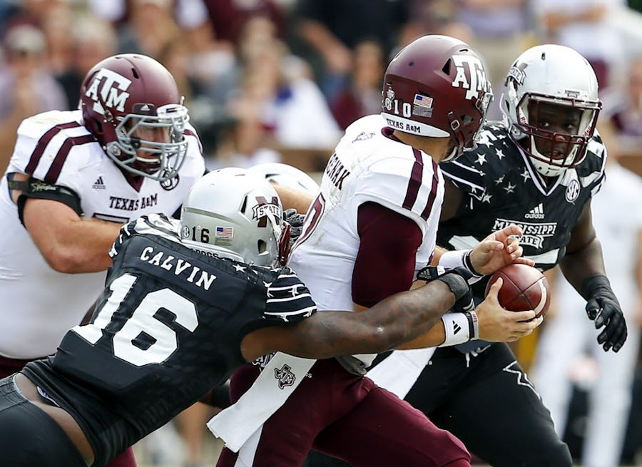 STARKVILLE, MS - NOVEMBER 5:  Defensive lineman Johnathan Calvin #16 of the Mississippi State Bulldogs strips the ball from quarterback Jake Hubenak #10 of the Texas A&M Aggies and the Bulldogs recovered during the second half of an NCAA college football game at Davis Wade Stadium on November 5, 2016 in Starkville, Mississippi. (Photo by Butch Dill/Getty Images)