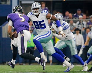 Dallas Cowboys defensive tackle David Irving (95) pressures Baltimore Ravens quarterback Joe Flacco (5) in the fourth quarter during the Baltimore Ravens vs. the Dallas Cowboys NFL football game at AT&T Stadium in Arlington, Texas on Sunday, November 20, 2016. (Louis DeLuca/The Dallas Morning News)